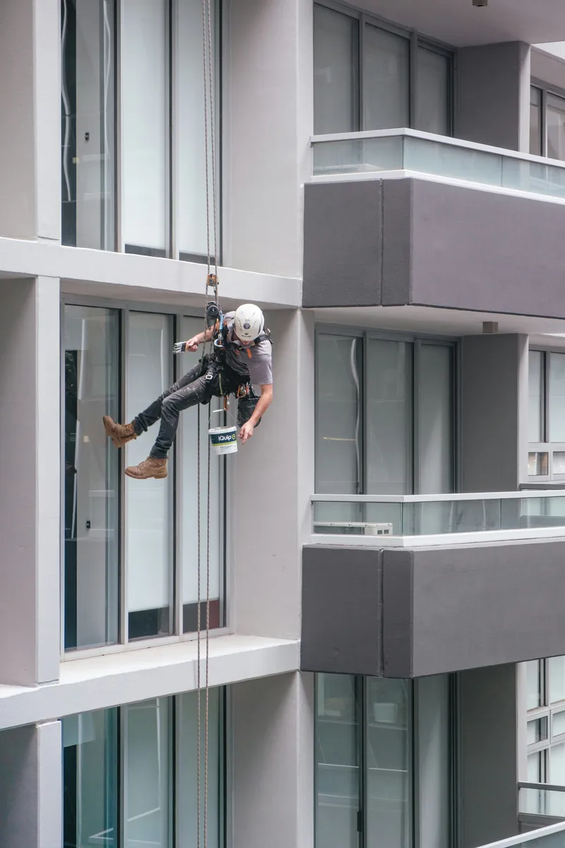 Rope access worker on a high-rise building